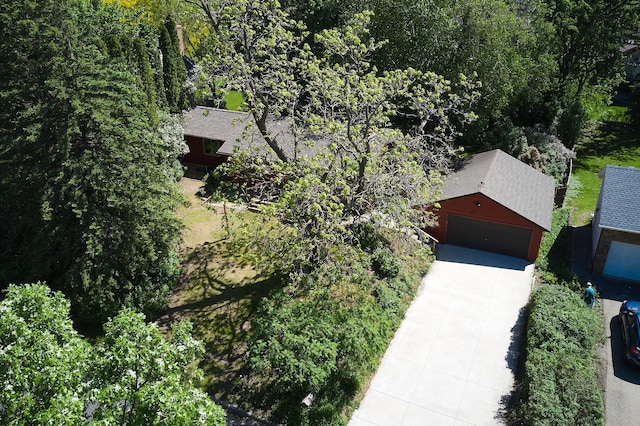 view from above of property featuring a heavily wooded area