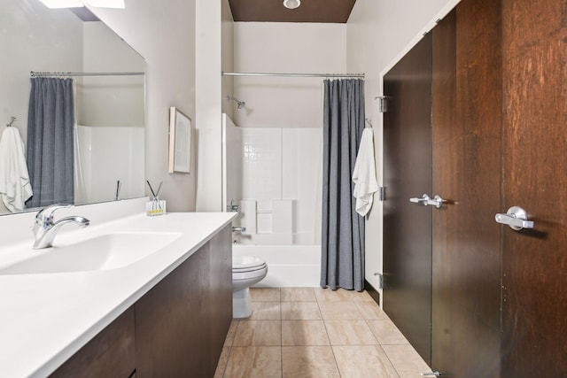 full bathroom featuring tile patterned floors, toilet, vanity, and shower / tub combo