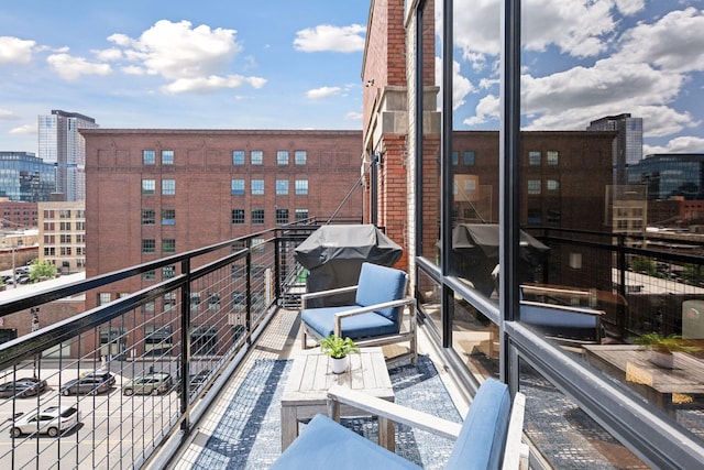 balcony featuring area for grilling