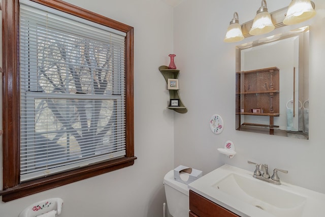 bathroom with toilet and vanity