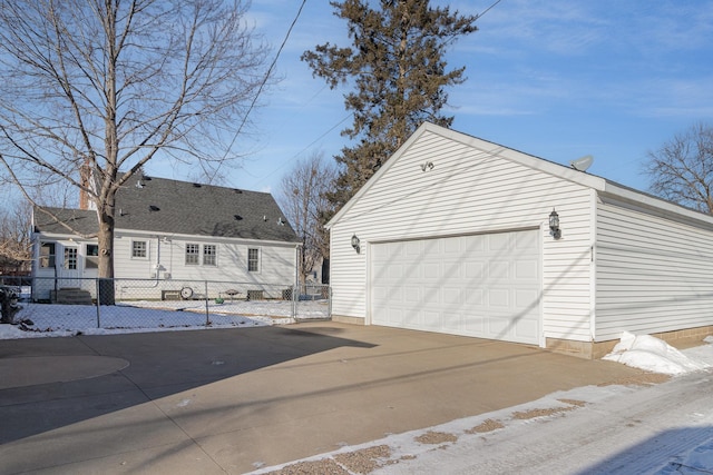 view of side of property with an outbuilding and a garage