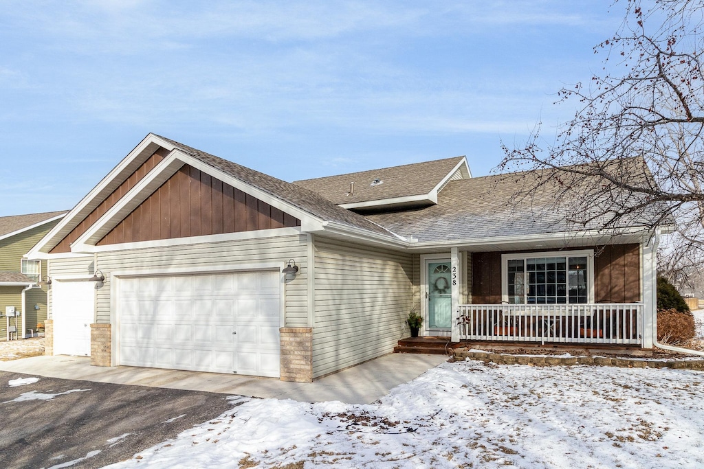 view of front of property featuring a garage and covered porch