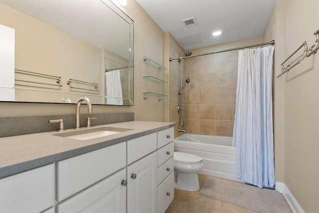 full bathroom featuring tile patterned flooring, vanity, shower / tub combo, and toilet