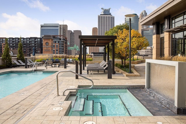 view of swimming pool with a community hot tub and a patio