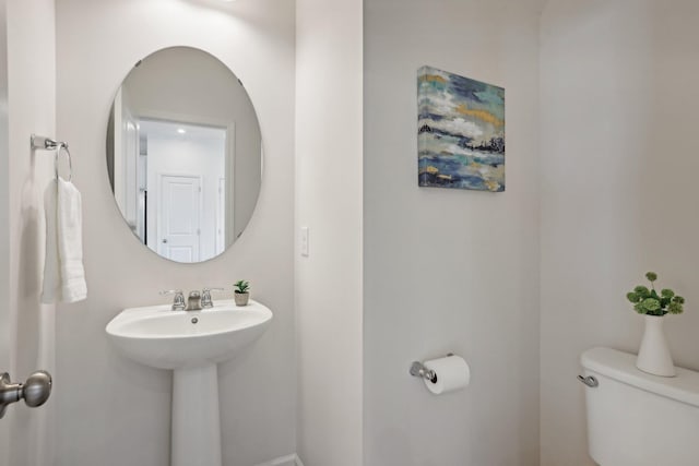 bathroom featuring sink and toilet