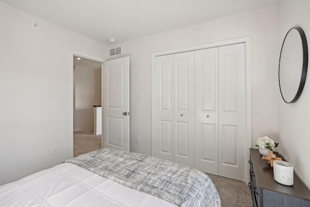 carpeted bedroom featuring a closet