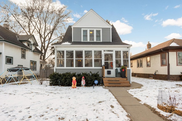 view of front of home with a sunroom