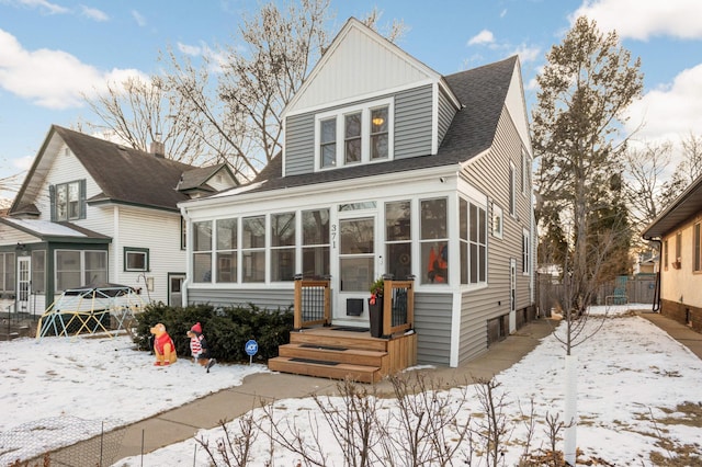 view of front of home featuring a sunroom