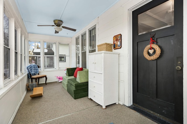 sunroom with ceiling fan