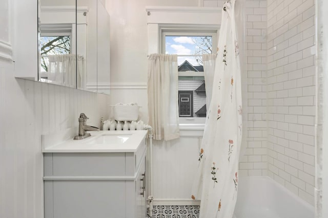 bathroom featuring shower / tub combo with curtain, vanity, and plenty of natural light