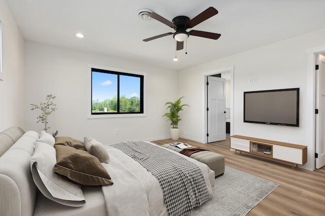 bedroom featuring ceiling fan and hardwood / wood-style flooring