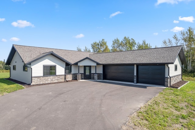 ranch-style home with a front yard and a garage