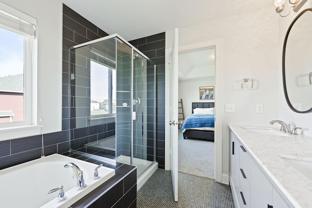 bathroom with plus walk in shower, tile patterned flooring, and vanity