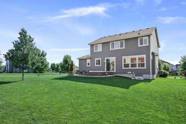 rear view of house with a lawn, an outdoor hangout area, and a patio