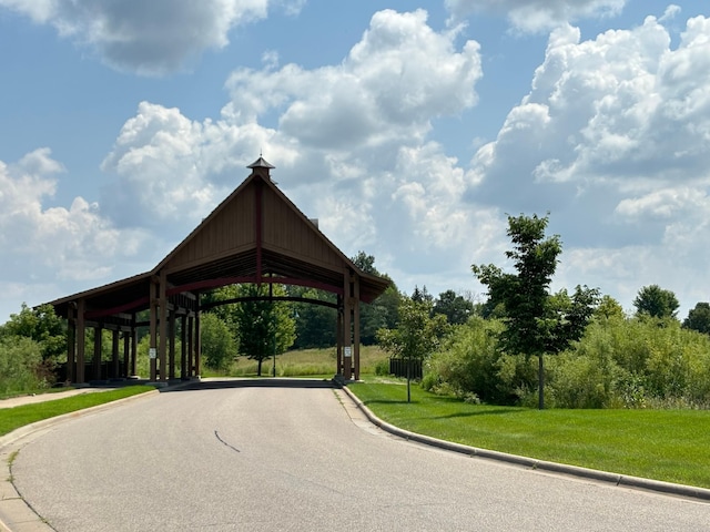 view of home's community with a lawn