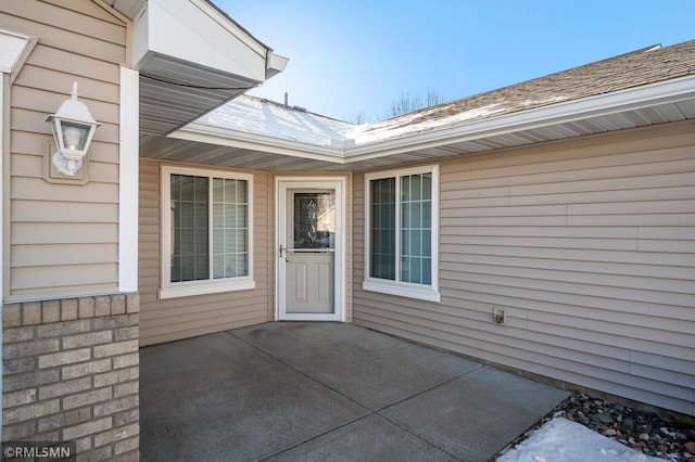 property entrance featuring a patio area