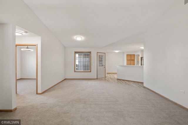 unfurnished living room with light carpet