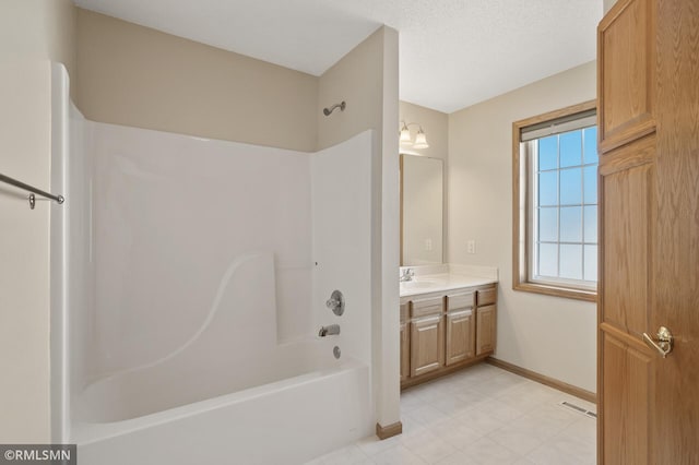 bathroom with vanity and bathing tub / shower combination