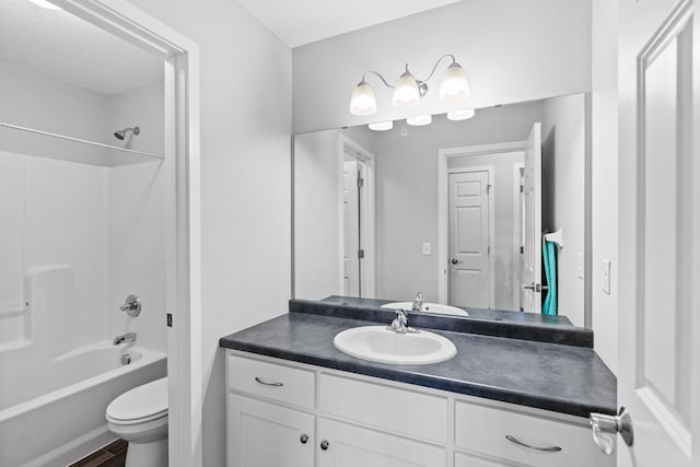 full bathroom featuring vanity, toilet, shower / bath combination, and a textured ceiling