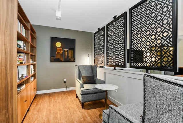 sitting room with light hardwood / wood-style floors