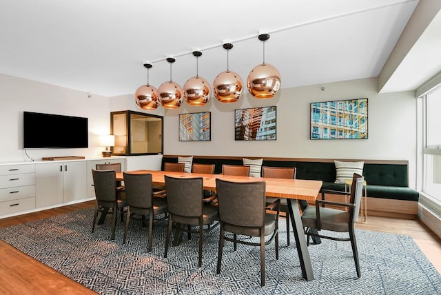 dining space with light hardwood / wood-style flooring