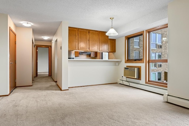 433 7th St Unit 1628, Minneapolis, MN 55415 - unfurnished living room featuring a baseboard radiator, light colored carpet, a wall mounted AC, a textured ceiling, and baseboards