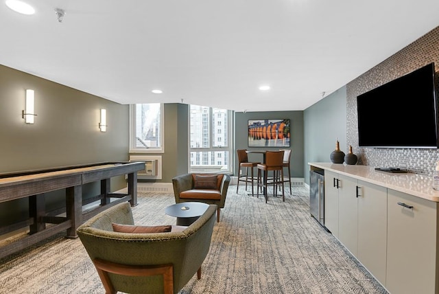 433 7th St Unit 1628, Minneapolis, MN 55415 - recreation room with wine cooler, baseboards, light colored carpet, heating unit, and recessed lighting