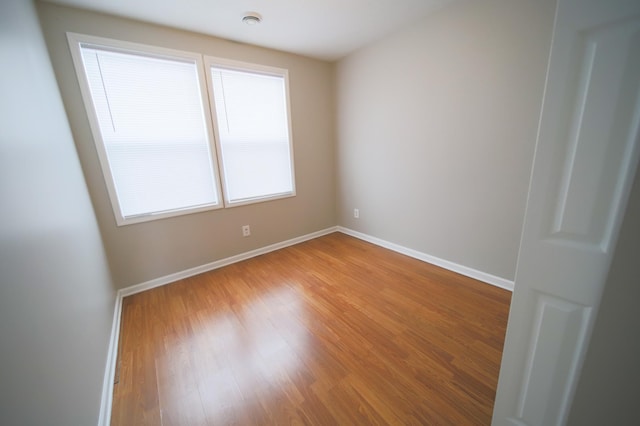 unfurnished room featuring wood-type flooring