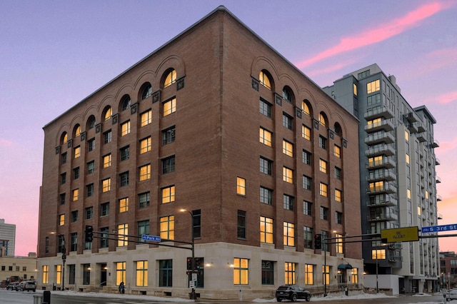 view of outdoor building at dusk