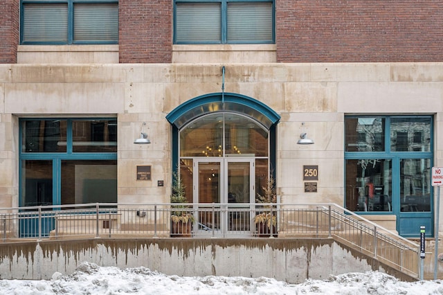 view of snow covered property entrance