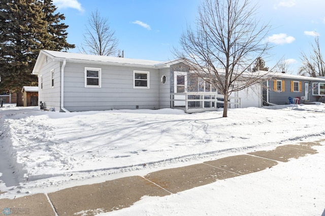 view of snow covered house