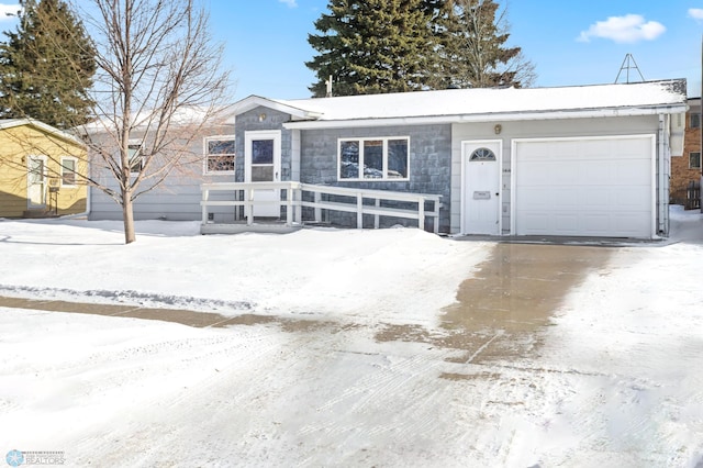 ranch-style house featuring a garage