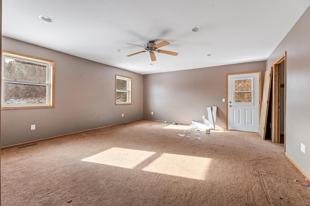 carpeted empty room with ceiling fan