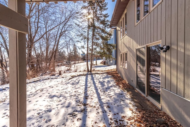 view of yard covered in snow