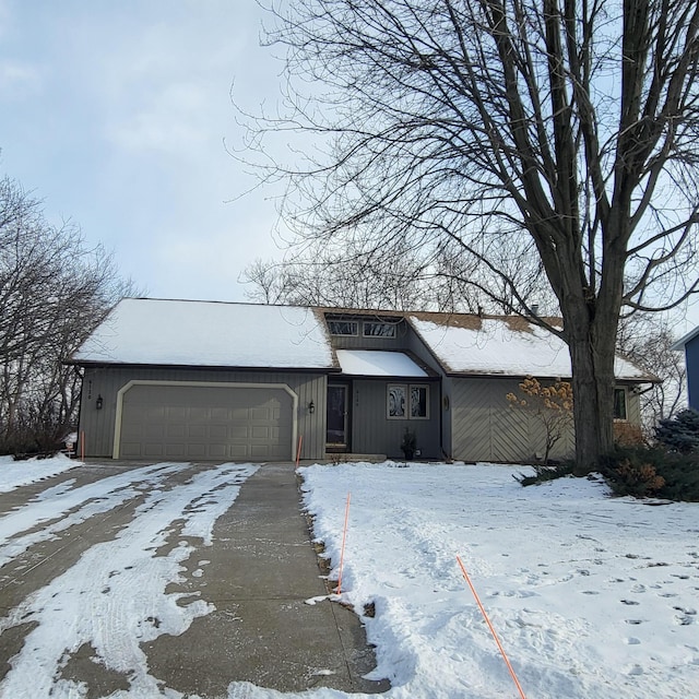 ranch-style home featuring a garage