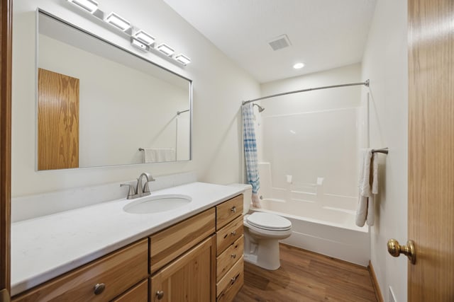 full bathroom featuring vanity, wood-type flooring, shower / bathtub combination with curtain, and toilet