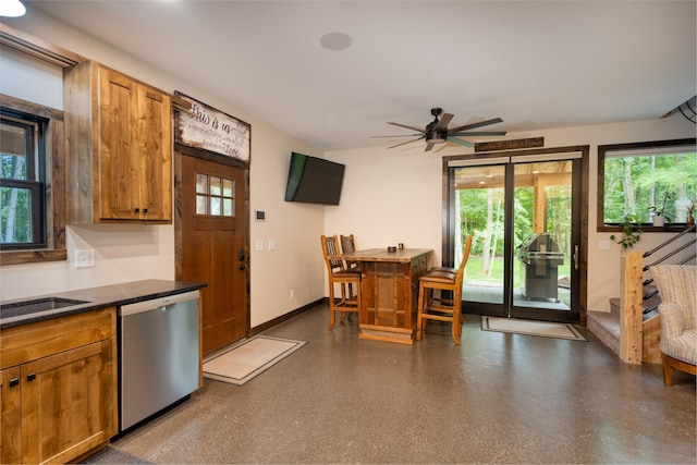 kitchen featuring sink, dishwasher, and ceiling fan