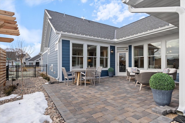 rear view of property with a patio and an outdoor hangout area