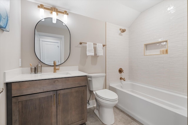 full bathroom with tiled shower / bath combo, toilet, vaulted ceiling, and vanity