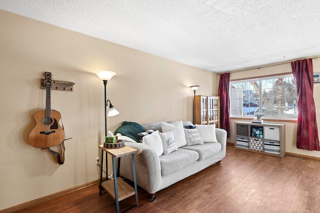 living room with hardwood / wood-style floors and a textured ceiling