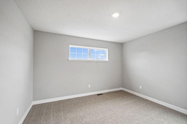 13617 Aulden Ave, Rosemount, MN 55068 - unfurnished room featuring visible vents, baseboards, carpet, and a textured ceiling