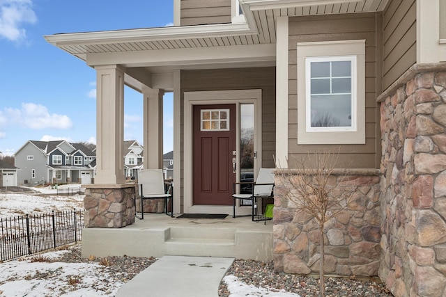 view of snow covered property entrance