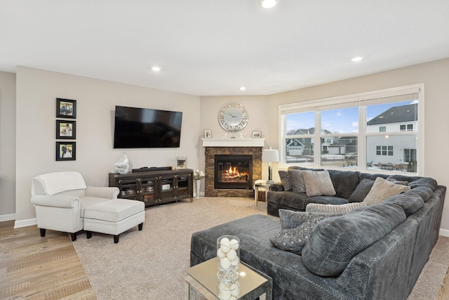 living room featuring a fireplace and wood-type flooring