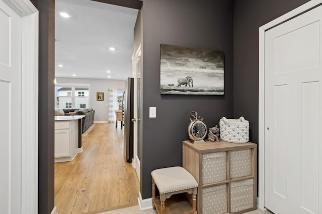 hallway featuring light wood-type flooring