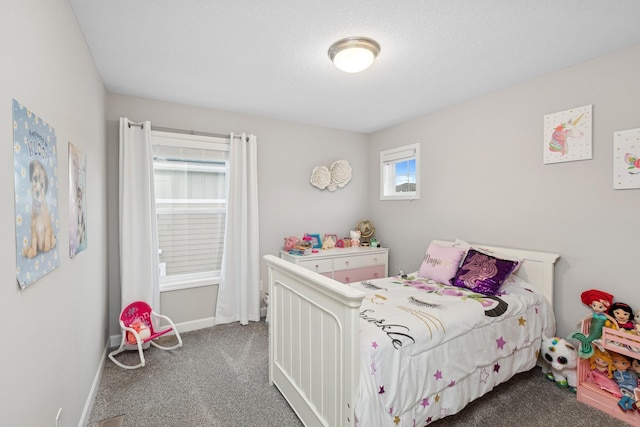 bedroom with dark carpet