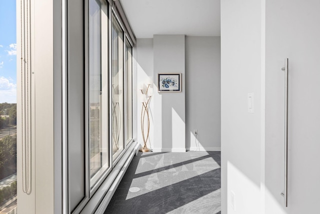 hallway featuring expansive windows