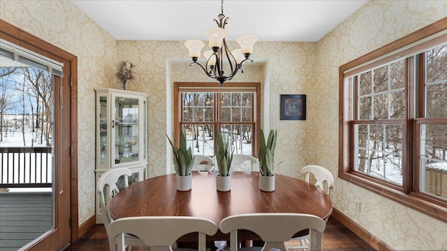 dining area featuring baseboards, dark wood-style flooring, and wallpapered walls