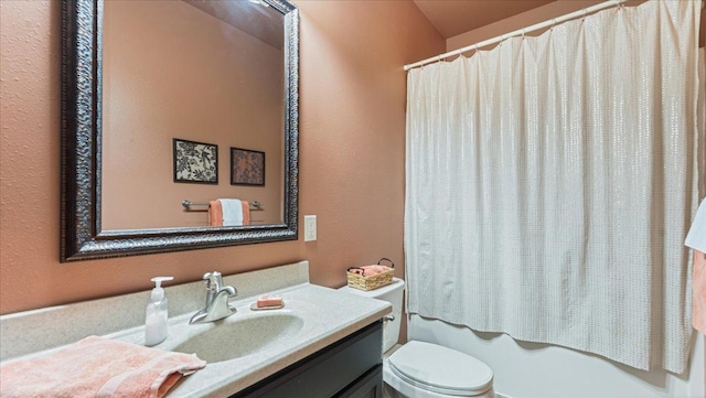 bathroom featuring shower / bath combination with curtain, vanity, and toilet