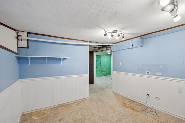 carpeted spare room featuring a textured ceiling