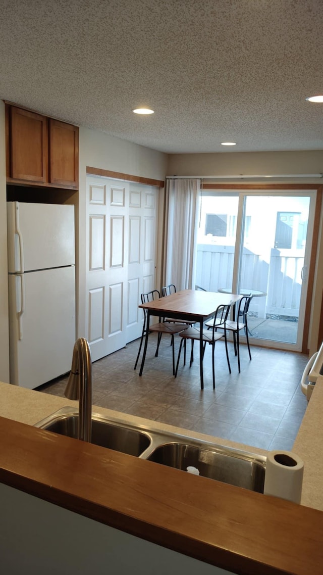 4970 149th St N Unit 3, Hugo, MN 55038 - dining space with recessed lighting, a textured ceiling, and light flooring
